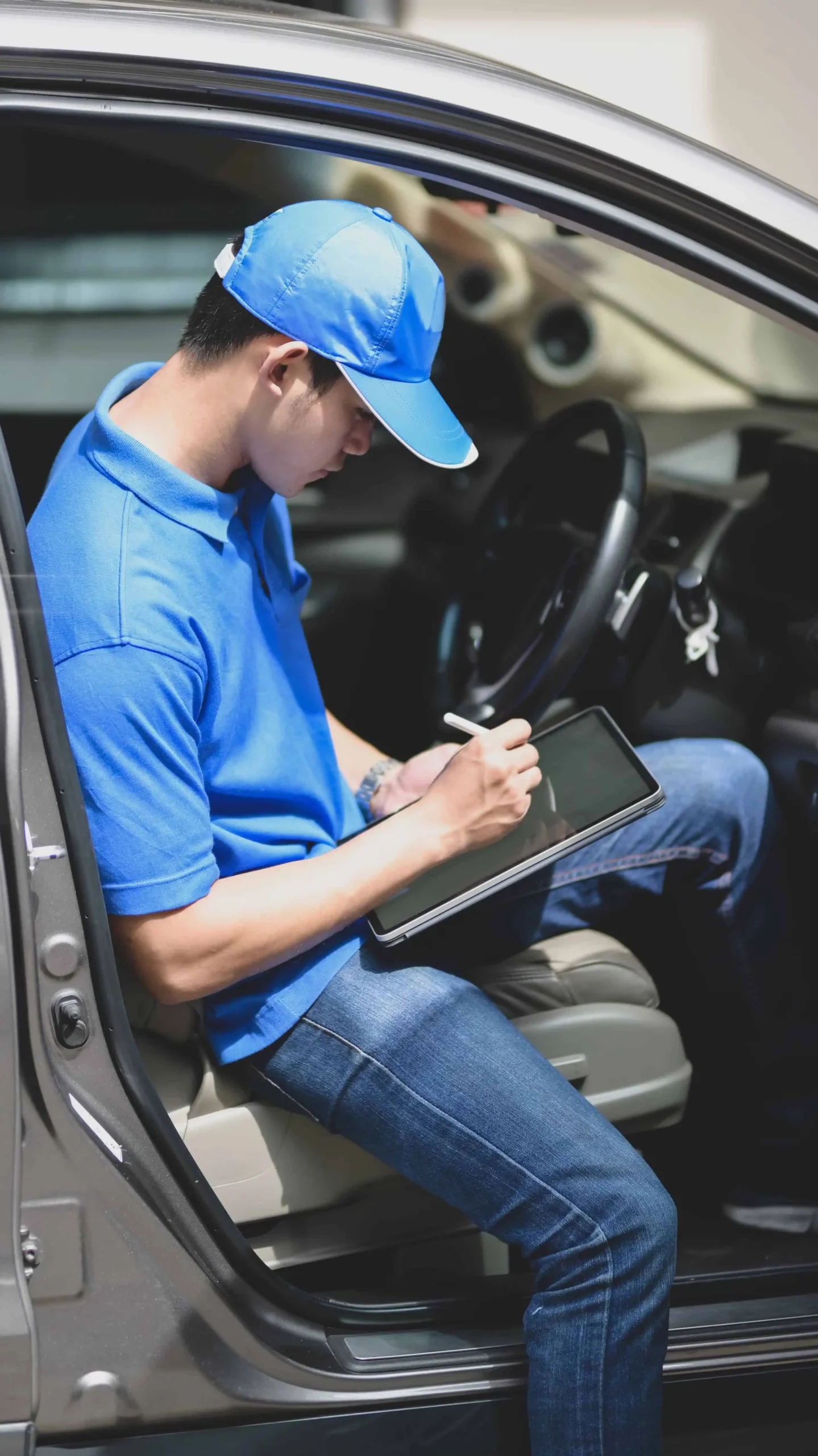 Auto dealer sitting in car