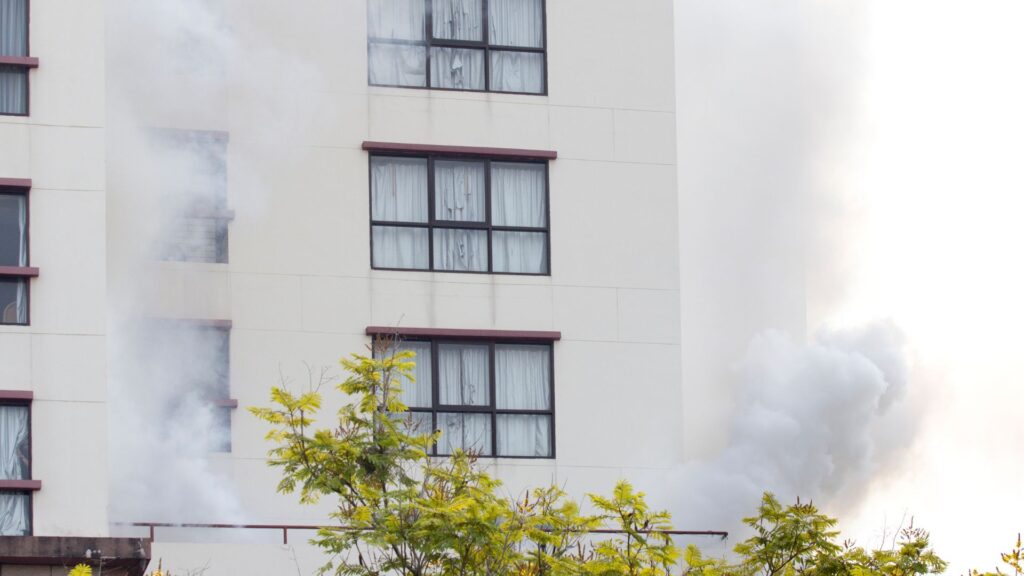 Apartment building with smoke coming out