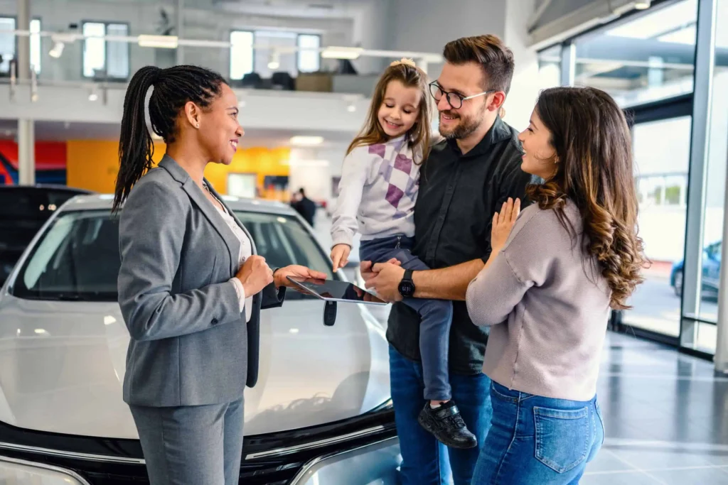 A family in a car dealership