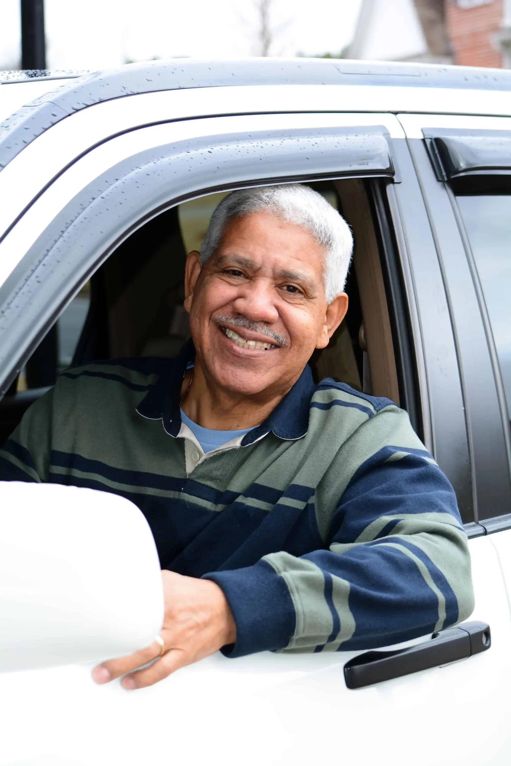 Man in car with window down